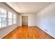 Classic living room with gleaming hardwood floors and large windows that provide natural light at 4589 Mesaview Way, Stone Mountain, GA 30083