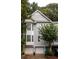 Inviting townhouse with a two-car garage, manicured landscaping, and a charming front door nestled in a leafy neighborhood at 951 Glenwood Se Ave # 3001, Atlanta, GA 30316