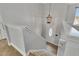 Bright foyer featuring a stairway, modern lighting, and a decorative glass door at 102 River Marsh Ln, Woodstock, GA 30188