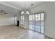 Dining room with hardwood floors, chandelier, and sliding doors to patio at 2029 Polesdean Trce, Duluth, GA 30097