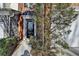 Townhome's front entrance with black door and stone accents at 2029 Polesdean Trce, Duluth, GA 30097