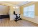 Bright living room with wood floors, crown molding, a large window, and view into the dining room at 2710 Royston Dr, Duluth, GA 30097