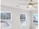 Bright bedroom with three large windows and a ceiling fan for added comfort at 5707 Tillman Way, Powder Springs, GA 30127