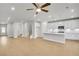 Open concept living area with hardwood floors, recessed lighting, and seamless flow into the kitchen at 5707 Tillman Way, Powder Springs, GA 30127