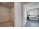 Bathroom view showing the tub with tile floors at 318 Delta Dr, Mcdonough, GA 30253