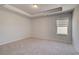 Bright bedroom featuring neutral carpet and a window bringing in natural light at 318 Delta Dr, Mcdonough, GA 30253