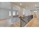 Hallway featuring beautiful wood floors and black iron railing at 318 Delta Dr, Mcdonough, GA 30253