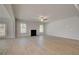 Spacious living room with a fireplace, large windows, and a door to the back yard at 318 Delta Dr, Mcdonough, GA 30253