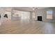 Open-concept living space featuring a kitchen, living room with fireplace, and an outdoor area at 318 Delta Dr, Mcdonough, GA 30253