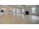 Open living area with a modern kitchen, fireplace, and plenty of natural light at 318 Delta Dr, Mcdonough, GA 30253