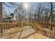 A view from a wooden deck shows the backyard at 105 Remington Ct, Woodstock, GA 30188