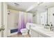 Bathroom features a shower-tub combo with a white vanity and updated fixtures at 23 Rumson Se Ct, Smyrna, GA 30080