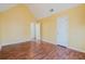 Bright yellow bedroom with wood floors, vaulted ceiling and entry to another room at 59 Pompas Ct, Dallas, GA 30157