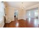 Open-concept dining room features hardwood floors and access to the bathroom and main living area at 59 Pompas Ct, Dallas, GA 30157