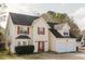 Charming two-story home featuring a two-car garage, red shutters, and a well-maintained front lawn at 59 Pompas Ct, Dallas, GA 30157