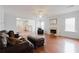 Bright living room with a fireplace, hardwood floors, and comfortable seating at 59 Pompas Ct, Dallas, GA 30157