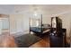 Main bedroom featuring hardwood floors and a large bed at 59 Pompas Ct, Dallas, GA 30157