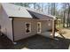 Rear exterior showcasing covered patio with beam supports at Tract1 Harmony Rd, Temple, GA 30179