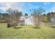 Backyard of home featuring a deck with stairs to the yard and mature trees at 1165 Hardin Bridge Rd, Euharlee, GA 30145