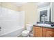 Clean bathroom featuring shower/tub, toilet, vanity and sink, and tile floor at 1165 Hardin Bridge Rd, Euharlee, GA 30145
