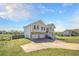 Charming two-story home with a two-car garage and steps leading to the front door under a blue sky at 1165 Hardin Bridge Rd, Euharlee, GA 30145