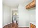 Hallway with hardwood floors, a view of the front door, and access to other areas at 1165 Hardin Bridge Rd, Euharlee, GA 30145