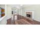 This living room boasts a vaulted ceiling, wood floors, a brick fireplace and back yard access at 1165 Hardin Bridge Rd, Euharlee, GA 30145