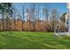 Large backyard with lush lawn, providing ample space for recreation at 1464 Oglethorpe Dr, Suwanee, GA 30024