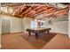 Finished basement with a pool table and plenty of space for recreation at 1464 Oglethorpe Dr, Suwanee, GA 30024