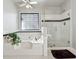 Bathroom boasts a large soaking tub and glass shower at 1464 Oglethorpe Dr, Suwanee, GA 30024