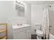 Clean bathroom features a shower/tub, toilet, vanity with sink, and mirror at 1464 Oglethorpe Dr, Suwanee, GA 30024