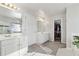 Double vanity bathroom with walk-in closet access at 1464 Oglethorpe Dr, Suwanee, GA 30024