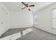 Bright bedroom featuring carpet and ceiling fan at 1464 Oglethorpe Dr, Suwanee, GA 30024
