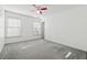 Spacious bedroom with carpet and ceiling fan at 1464 Oglethorpe Dr, Suwanee, GA 30024