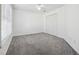 Well-lit bedroom with double door closet and carpet at 1464 Oglethorpe Dr, Suwanee, GA 30024