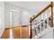 Spacious entryway with hardwood floors and access to the stairs and backyard at 1464 Oglethorpe Dr, Suwanee, GA 30024