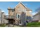 Two-story house with a large deck and attached garage at 1464 Oglethorpe Dr, Suwanee, GA 30024