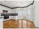 Modern kitchen with white cabinets, black accents, and a breakfast nook at 1464 Oglethorpe Dr, Suwanee, GA 30024