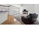 Spacious living room featuring a fireplace and hardwood floors at 1464 Oglethorpe Dr, Suwanee, GA 30024