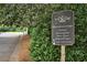 Community recreation center sign featuring a clubhouse, pool, tennis, and basketball courts at 1464 Oglethorpe Dr, Suwanee, GA 30024