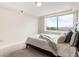 Bright bedroom featuring a neutral color scheme, carpeting, and a large window with a city view at 2479 Peachtree Ne Rd # 605, Atlanta, GA 30305