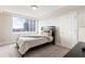 Bedroom featuring a light color scheme, carpeting, and a large window with city views at 2479 Peachtree Ne Rd # 605, Atlanta, GA 30305