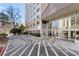 A high-rise building with well-maintained landscaping and a designated parking area at 2479 Peachtree Ne Rd # 605, Atlanta, GA 30305