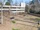 A dog park with a fenced area, benches, steps, and a pet waste station at 2479 Peachtree Ne Rd # 605, Atlanta, GA 30305