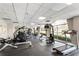 Well-equipped gym with modern equipment, weights, treadmills, and abundant natural light at 2479 Peachtree Ne Rd # 605, Atlanta, GA 30305