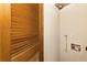 A laundry room with a wood-slatted door showing hook-ups for a washer and dryer at 2479 Peachtree Ne Rd # 605, Atlanta, GA 30305