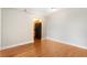 Bright living room with hardwood floors and an adjacent kitchen featuring black appliances at 2479 Peachtree Ne Rd # 605, Atlanta, GA 30305