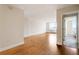 Bright living room with gleaming hardwood floors, fresh paint, and a doorway to the bedroom at 2479 Peachtree Ne Rd # 605, Atlanta, GA 30305