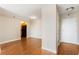 An airy room featuring hardwood floors with an open concept kitchen in the background at 2479 Peachtree Ne Rd # 605, Atlanta, GA 30305