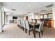 Lounge area with a TV, multiple seating options and a long table with chairs at 2479 Peachtree Ne Rd # 605, Atlanta, GA 30305